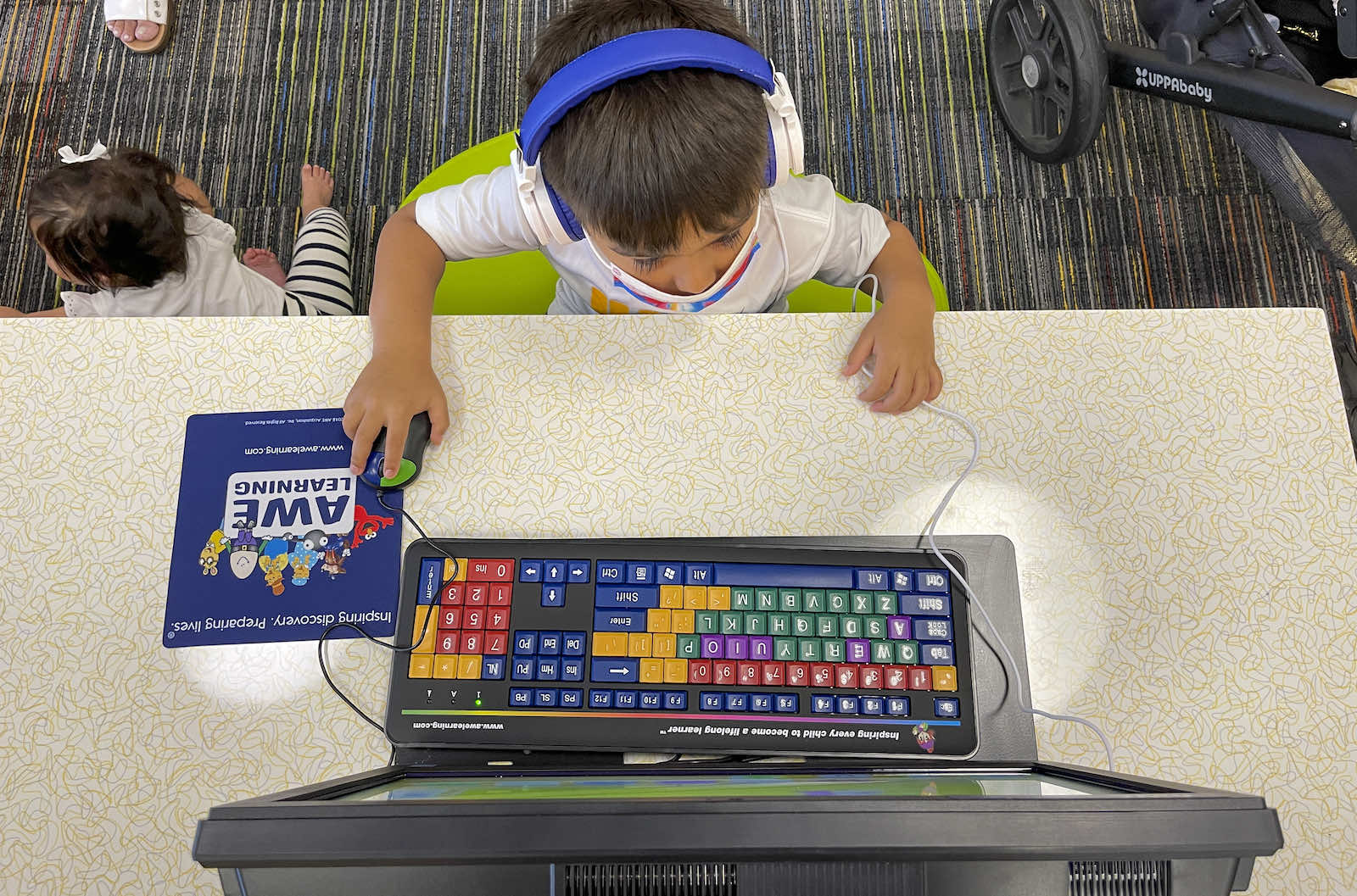 Child playing an educational computer game