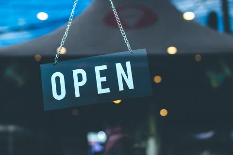 an image of a shop sign that says 'open'