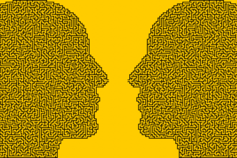 two faces silhouetted, with labyrinth pattern inside