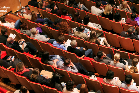 Image of people sitting in a lecture theatre